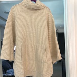 new with tags: UGG ivory wool turtle neck sweater.